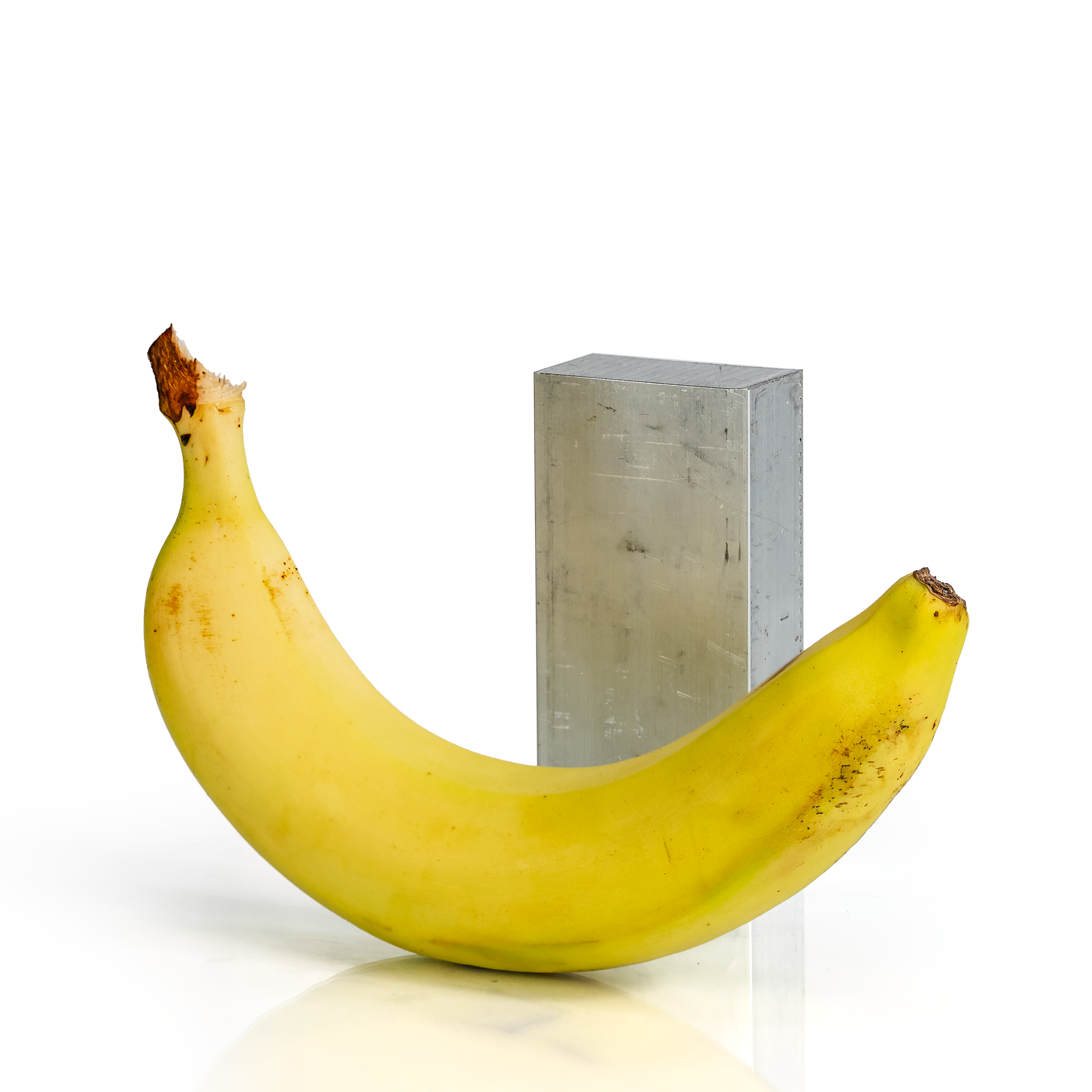 1x2x4 6061 T6 Aluminum Block with banana for scale - BananaMetals.com