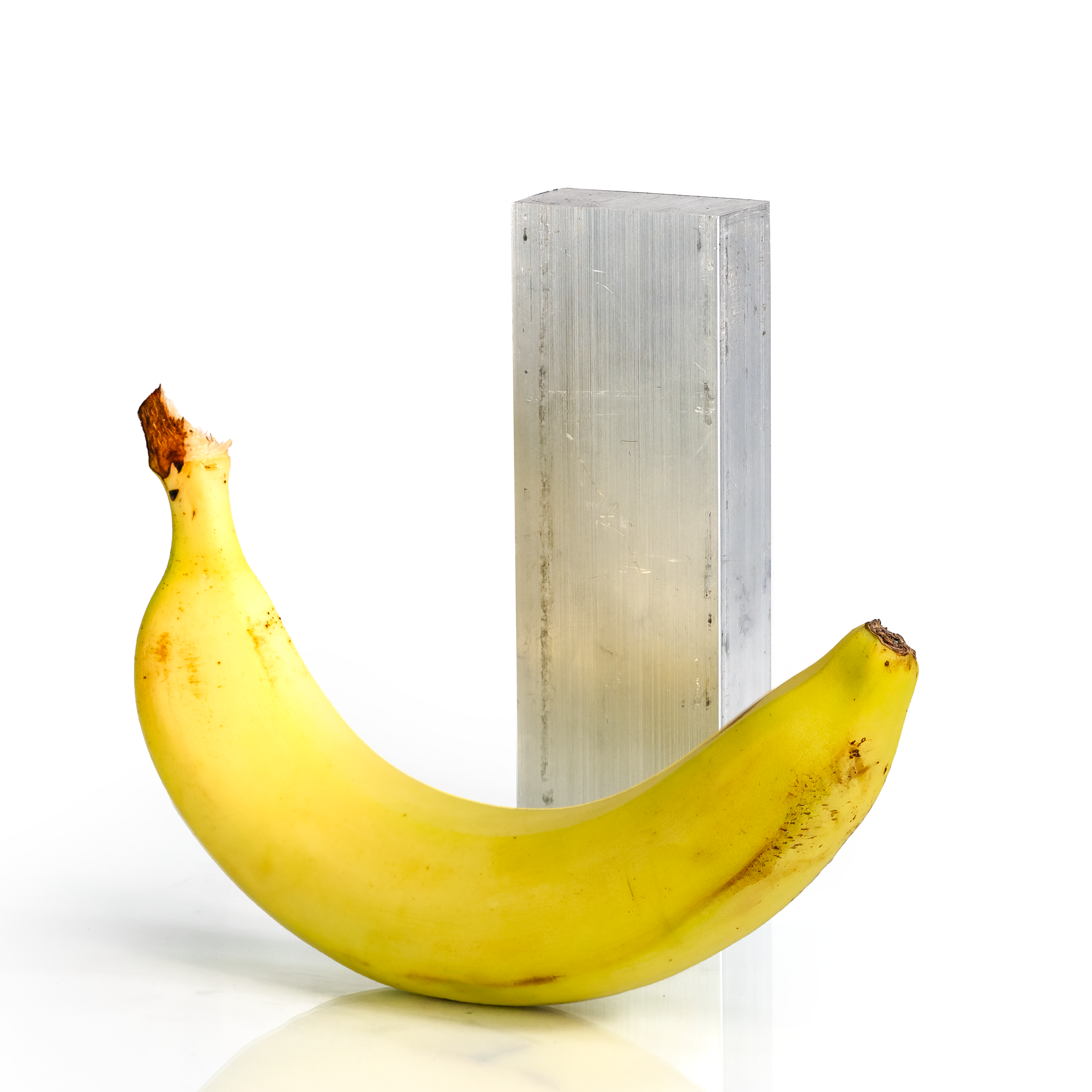 1x2x6 6061 T6 Aluminum Block with banana for scale - BananaMetals.com