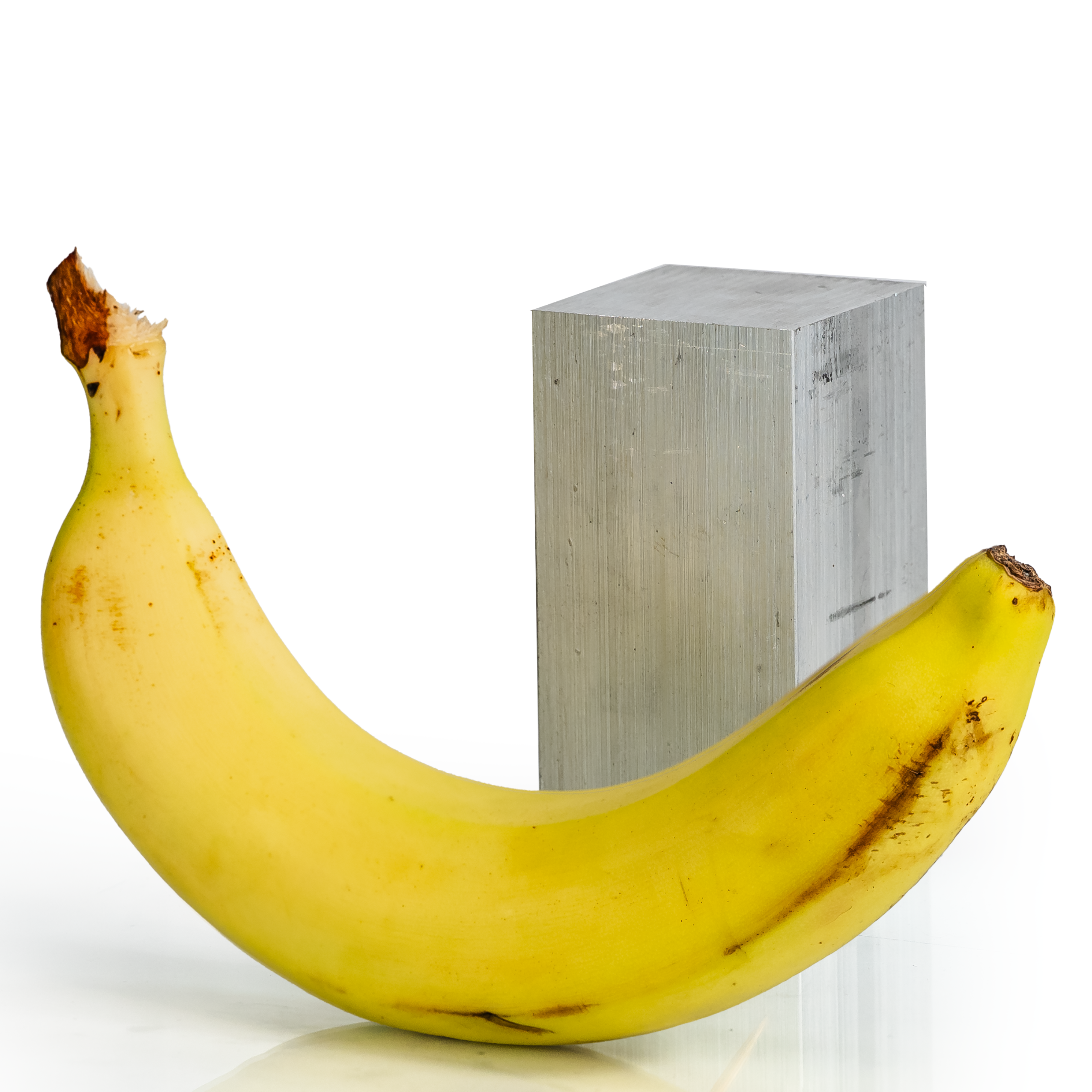 2x2x4 6061 T6 Aluminum Block with banana for scale - BananaMetals.com