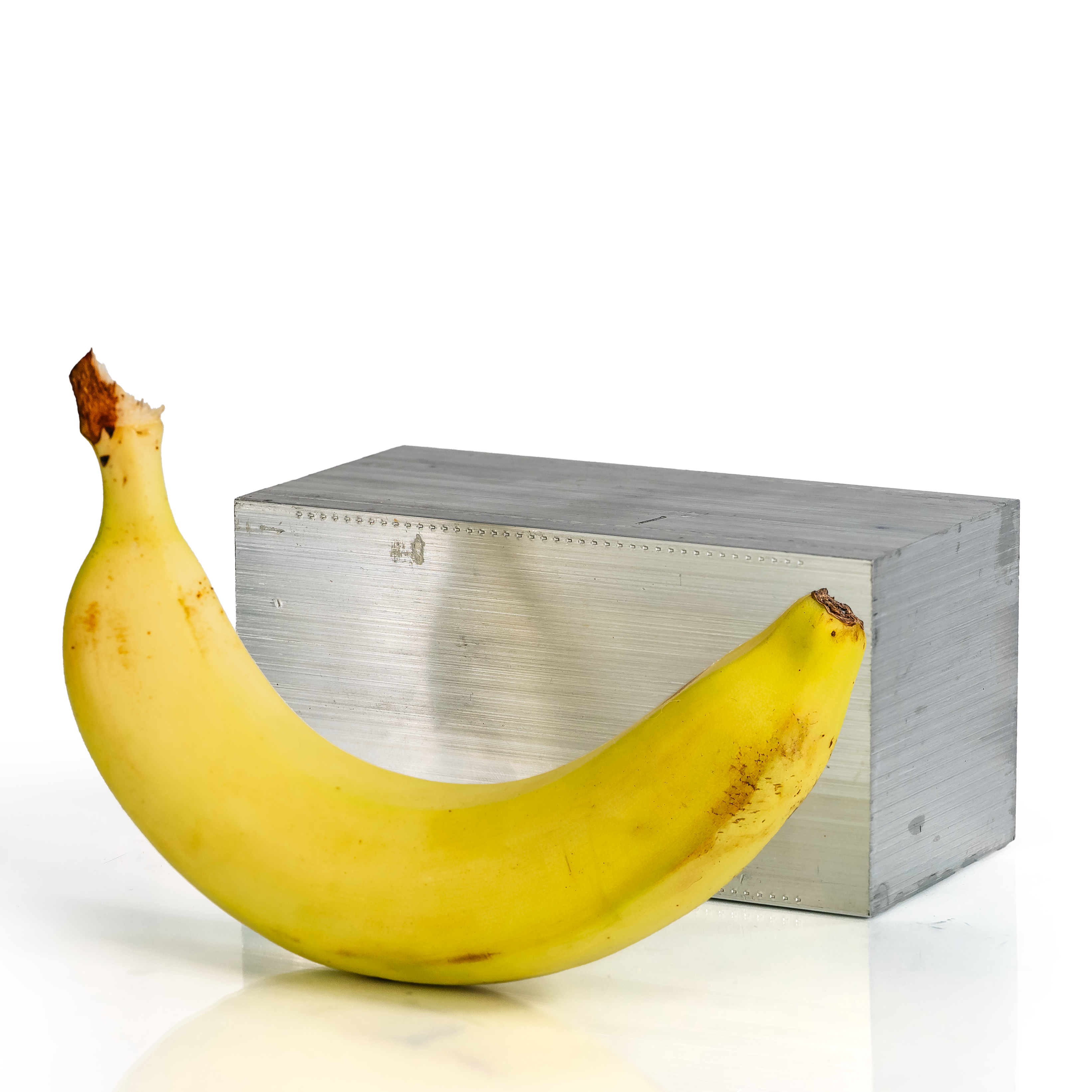 3x3x6 6061 T6 Aluminum Block with banana for scale - BananaMetals.com