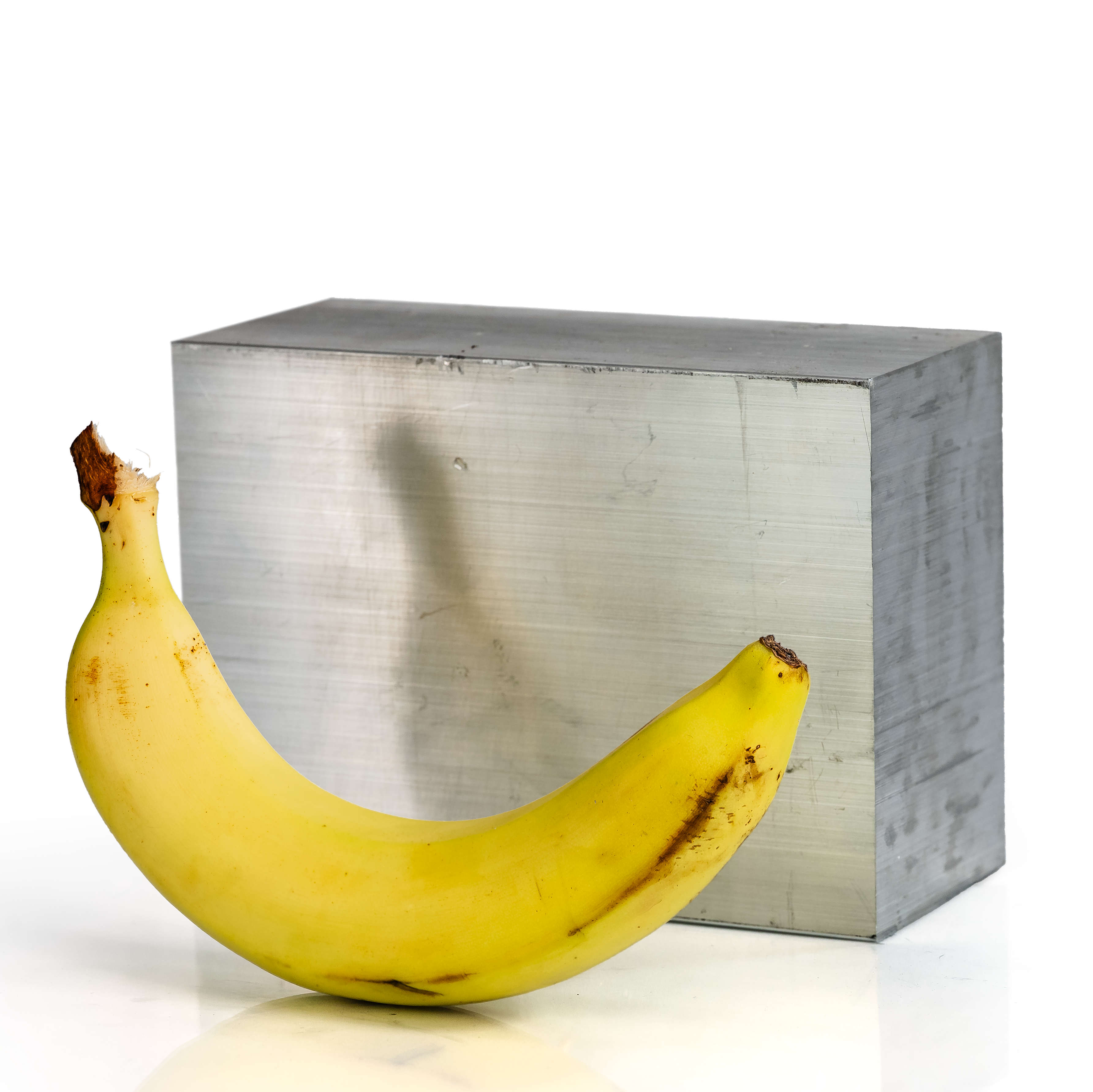3x5x7 6061 T6 Aluminum Block with banana for scale - BananaMetals.com